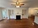 Cozy living room with hardwood floors, fireplace, and built-in shelving at 2912 Ashlyn Pointe Dr, Atlanta, GA 30340