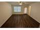 Spacious living room with modern vinyl plank flooring and a ceiling fan, providing comfort and style at 2912 Ashlyn Pointe Dr, Atlanta, GA 30340