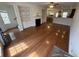 Sunlit living room with hardwood floors, fireplace, and open floor plan at 2912 Ashlyn Pointe Dr, Atlanta, GA 30340