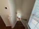 A staircase with carpeted steps and a wooden handrail leads to the upper level of the home at 2912 Ashlyn Pointe Dr, Atlanta, GA 30340