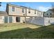 Fenced backyard with patio and grassy area at 319 Quincy Ave, Mcdonough, GA 30253