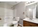 Clean bathroom with a tub, toilet and vanity at 319 Quincy Ave, Mcdonough, GA 30253