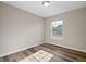 Bright bedroom with light walls and wood-look flooring at 319 Quincy Ave, Mcdonough, GA 30253