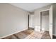 Spacious bedroom featuring a large closet and wood-look flooring at 319 Quincy Ave, Mcdonough, GA 30253