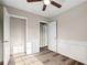 Well-lit bedroom with hardwood floors and walk-in closet at 319 Quincy Ave, Mcdonough, GA 30253