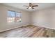 Spacious bedroom with ceiling fan and hardwood floors at 319 Quincy Ave, Mcdonough, GA 30253