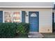 Blue front door entry to a tan-sided townhouse at 319 Quincy Ave, Mcdonough, GA 30253