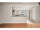 Open kitchen with breakfast bar and hardwood floors at 319 Quincy Ave, Mcdonough, GA 30253
