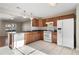 Bright kitchen with wood cabinets, granite countertops, and modern appliances at 319 Quincy Ave, Mcdonough, GA 30253