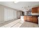 Modern kitchen features wood cabinets, granite countertops, and tiled floors at 319 Quincy Ave, Mcdonough, GA 30253