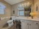 Bathroom with a large vanity, shower, and toilet at 752 Bostonian Way, Lawrenceville, GA 30046