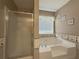 Relaxing bathroom with corner bathtub and shower at 752 Bostonian Way, Lawrenceville, GA 30046