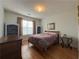 Cozy bedroom with hardwood floors and built-in shelves at 752 Bostonian Way, Lawrenceville, GA 30046