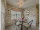 Bright breakfast nook with floral wallpaper and a window seat at 752 Bostonian Way, Lawrenceville, GA 30046