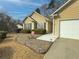 House exterior showcasing walkway, landscaping, and attached garage at 752 Bostonian Way, Lawrenceville, GA 30046