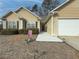 House exterior showcasing walkway, landscaping, and attached garage at 752 Bostonian Way, Lawrenceville, GA 30046