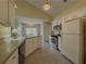 Inviting kitchen featuring white cabinets, stainless steel appliances, and an island at 752 Bostonian Way, Lawrenceville, GA 30046