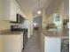 Modern kitchen with white cabinets, stainless steel appliances, and an island at 752 Bostonian Way, Lawrenceville, GA 30046