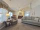 Living room with neutral carpeting, fireplace, and ample natural light at 752 Bostonian Way, Lawrenceville, GA 30046