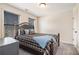 Bedroom with carpeted floor and two windows at 1005 Greenridge Trl, Loganville, GA 30052