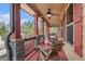 Relaxing front porch with rocking chairs and ceiling fan at 1005 Greenridge Trl, Loganville, GA 30052