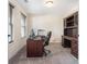 Home office with built-in cabinetry and hardwood desk at 1005 Greenridge Trl, Loganville, GA 30052