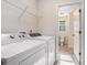 Laundry room with washer, dryer and additional storage at 1005 Greenridge Trl, Loganville, GA 30052