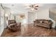 Living room with hardwood floors, fireplace, and comfortable seating at 1005 Greenridge Trl, Loganville, GA 30052