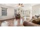 Open living room with hardwood floors and access to kitchen at 1005 Greenridge Trl, Loganville, GA 30052