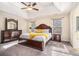 Large main bedroom with carpeted floors and ensuite bathroom at 1005 Greenridge Trl, Loganville, GA 30052