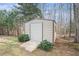 Metal storage shed with wooden ramp at 1005 Greenridge Trl, Loganville, GA 30052