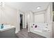 Bathroom with soaking tub, walk-in shower, and double vanity at 2958 Arden Ridge Ter, Suwanee, GA 30024