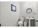 Clean and updated half bathroom with pedestal sink at 2958 Arden Ridge Ter, Suwanee, GA 30024