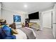 Bright bedroom featuring a comfortable bed and large TV at 2958 Arden Ridge Ter, Suwanee, GA 30024
