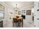Charming dining area with chandelier and access to laundry at 2958 Arden Ridge Ter, Suwanee, GA 30024