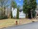 Two-story white house with driveway and landscaping at 2958 Arden Ridge Ter, Suwanee, GA 30024