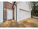 White garage with attached side entry at 2958 Arden Ridge Ter, Suwanee, GA 30024