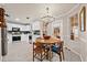 Open concept kitchen with a dining area and backyard access at 2958 Arden Ridge Ter, Suwanee, GA 30024