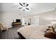 Spacious main bedroom with high ceilings, king bed, and TV at 2958 Arden Ridge Ter, Suwanee, GA 30024