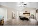 Main bedroom with king bed, ceiling fan, and large mirror at 2958 Arden Ridge Ter, Suwanee, GA 30024