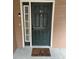 Dark green front door with a welcome mat at 3500 Sweetwater Rd # 424, Duluth, GA 30096
