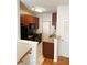 Galley kitchen with granite countertops and wood cabinets at 3500 Sweetwater Rd # 424, Duluth, GA 30096