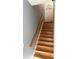 Wooden staircase leading to the upper level at 3500 Sweetwater Rd # 424, Duluth, GA 30096