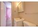 Small bathroom with toilet, sink, and medicine cabinet at 1533 Harbour Oaks Rd, Tucker, GA 30084