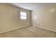 Bedroom with wood paneled walls and neutral carpeting at 1533 Harbour Oaks Rd, Tucker, GA 30084