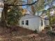 Side view of a white brick house showing additional exterior details at 1814 N Druid Hills Ne Rd, Brookhaven, GA 30319
