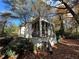 Side view of a white brick house with a screened porch at 1814 N Druid Hills Ne Rd, Brookhaven, GA 30319