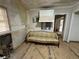 A vintage sofa sits in a kitchen undergoing renovations at 1814 N Druid Hills Ne Rd, Brookhaven, GA 30319