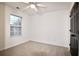 Bright bedroom with neutral carpeting and ceiling fan at 2555 Flat Shoals Rd # 3005, South Fulton, GA 30349