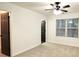 Bright bedroom with neutral walls, carpet, and two doors at 2555 Flat Shoals Rd # 3005, South Fulton, GA 30349